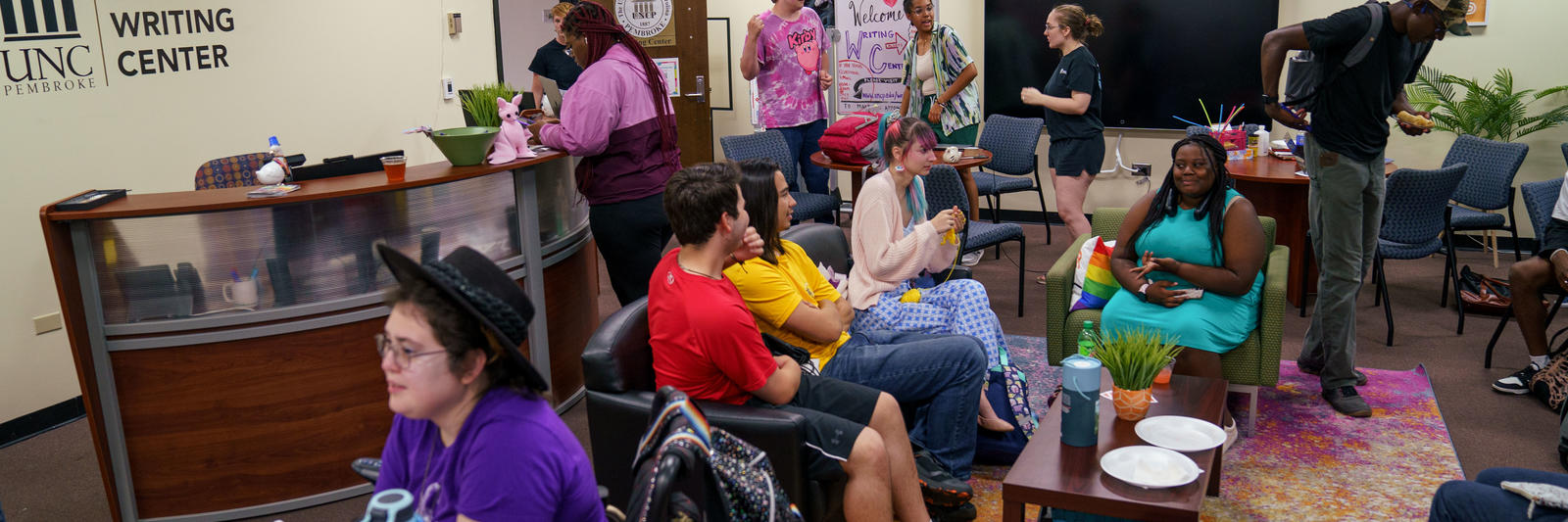 People at the writing center sitting and talking